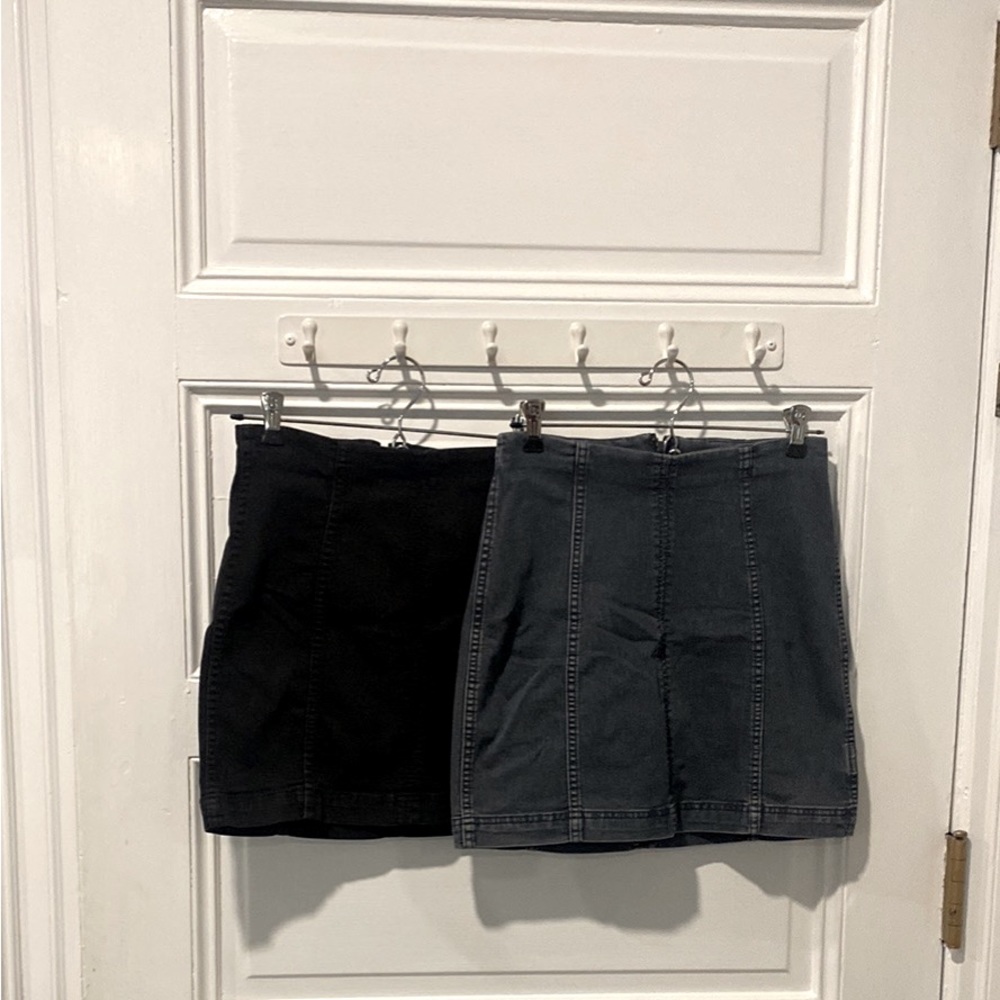 Two free people mini skirts. Both denim. One black, one blue.